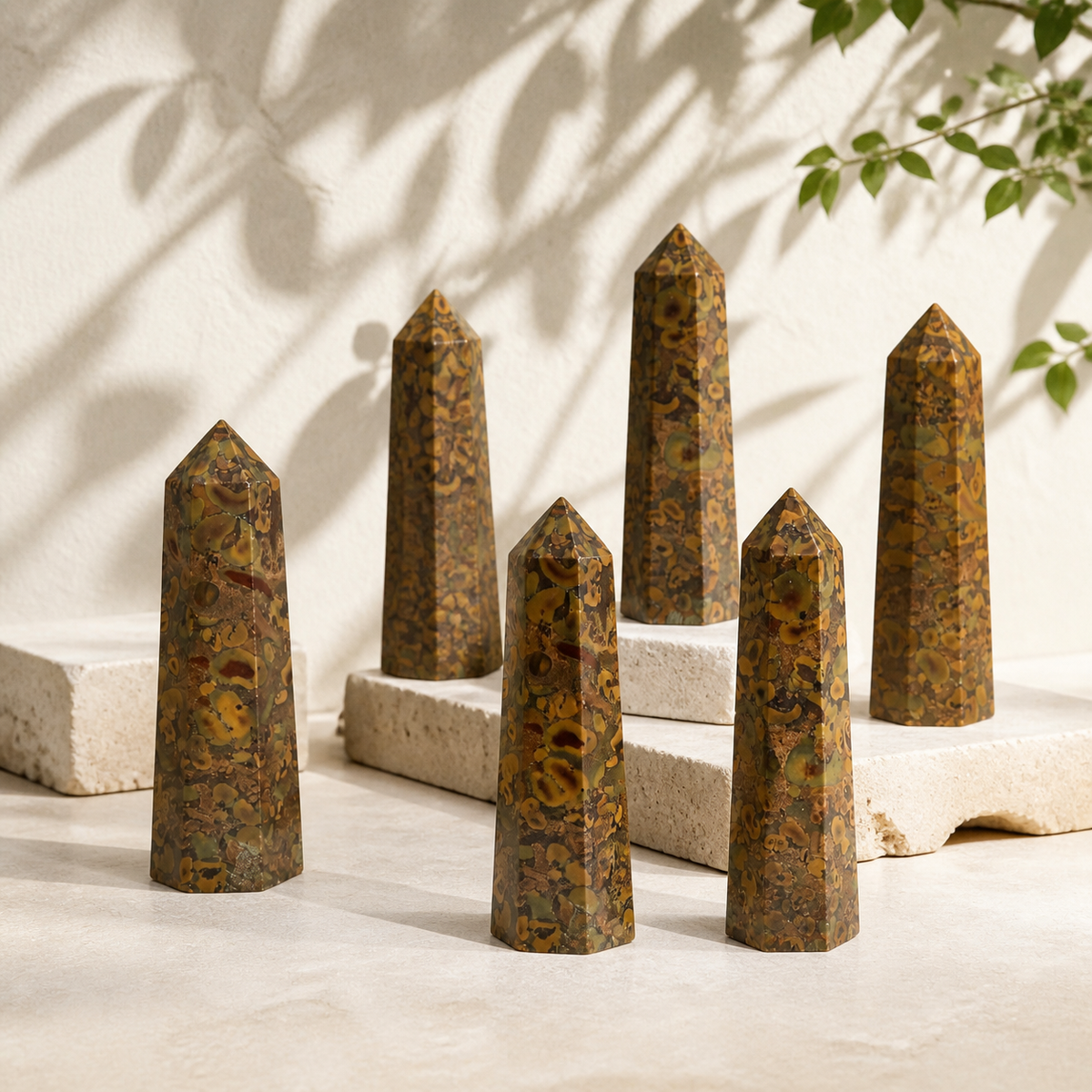 Ajooba Jasper crystal points displayed together in natural light