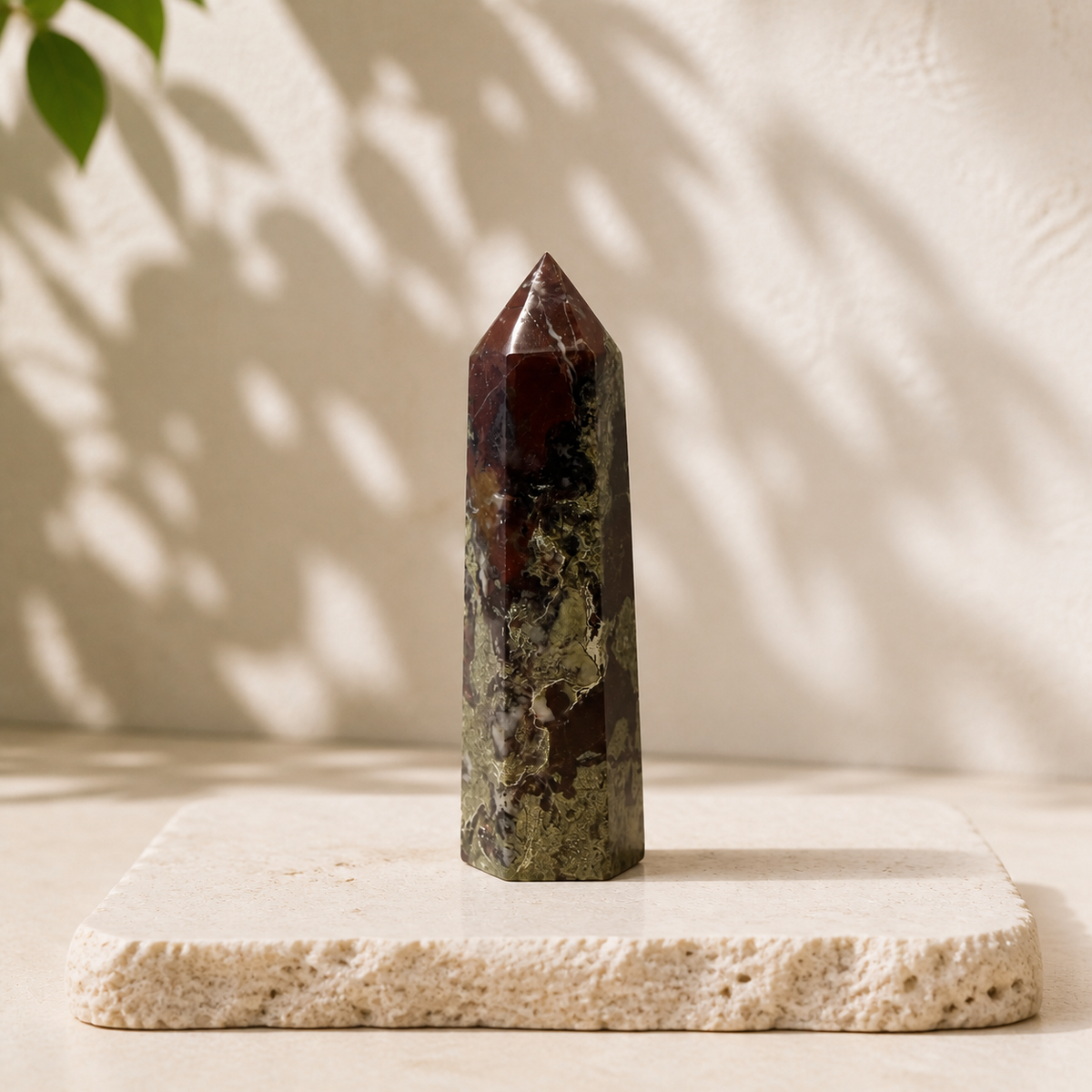 Dragon Blood Jasper tower BY on a cream stone slab