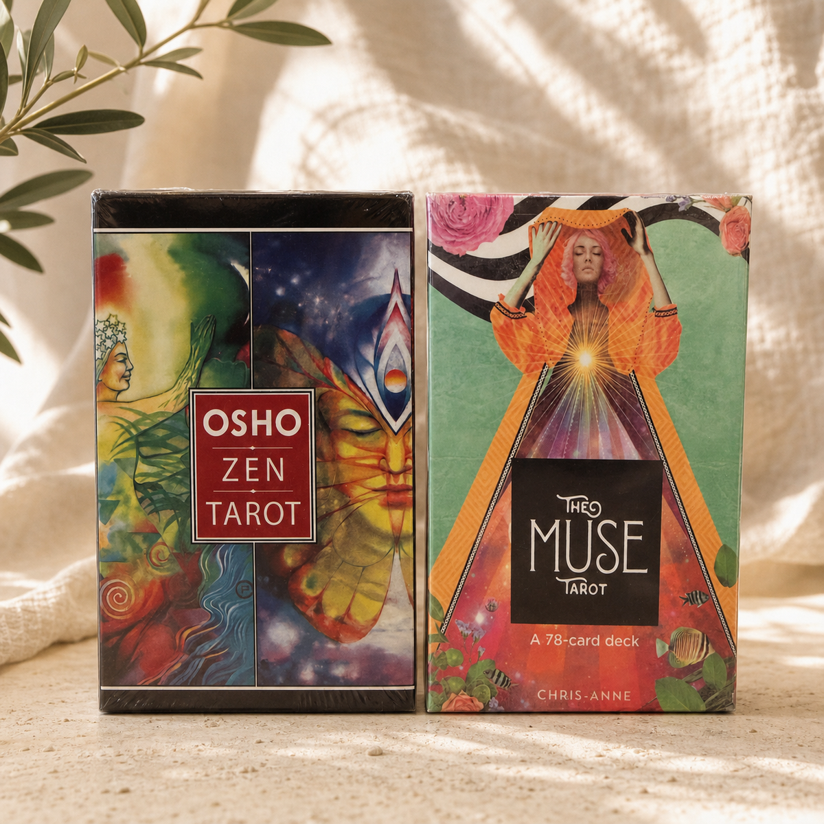 Osho Zen Tarot and The Muse Tarot sealed decks in warm natural light