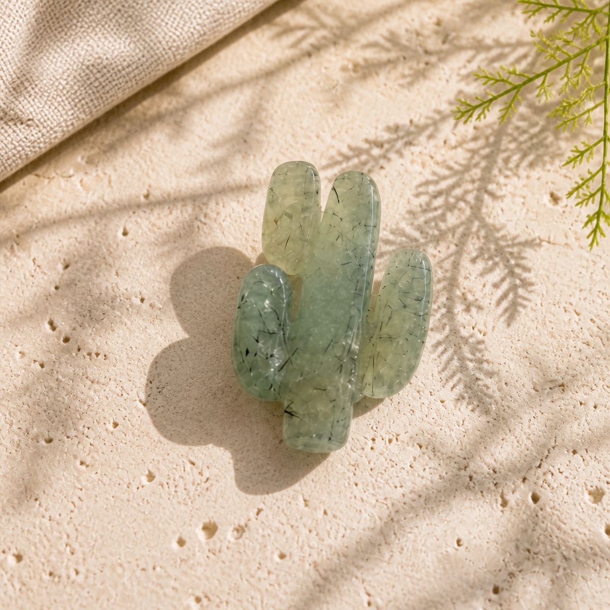 Single polished Prehnite cactus crystal carving in natural window light