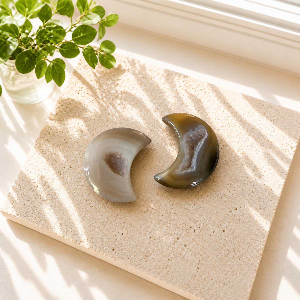 Two Druzy Agate moon carvings with sparkling crystal centres