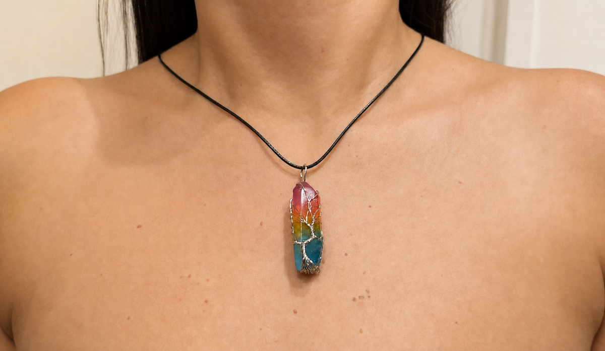 Rainbow Quartz Tree of Life pendant worn on a black cord necklace