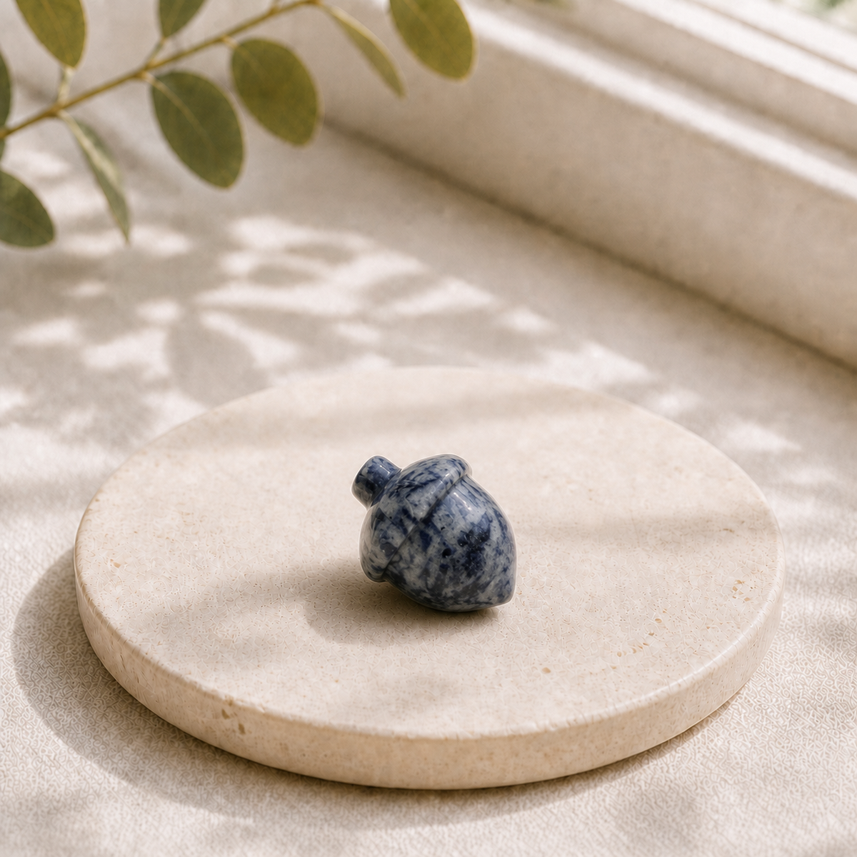 Sodalite polished crystal acorn carving